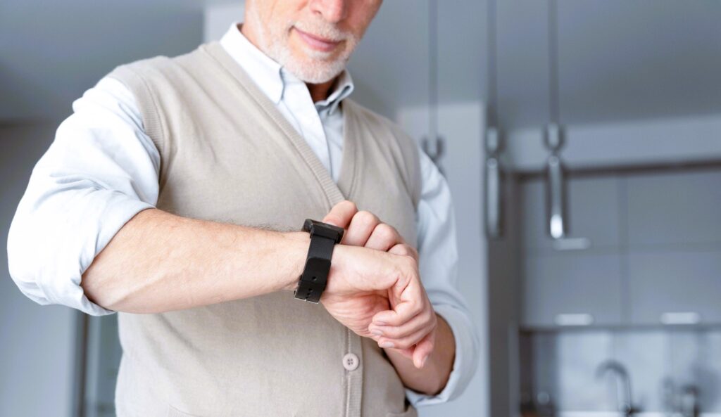 Tech Solutions for Seniors - Close up man with smartwatch Monitoring Brain Health