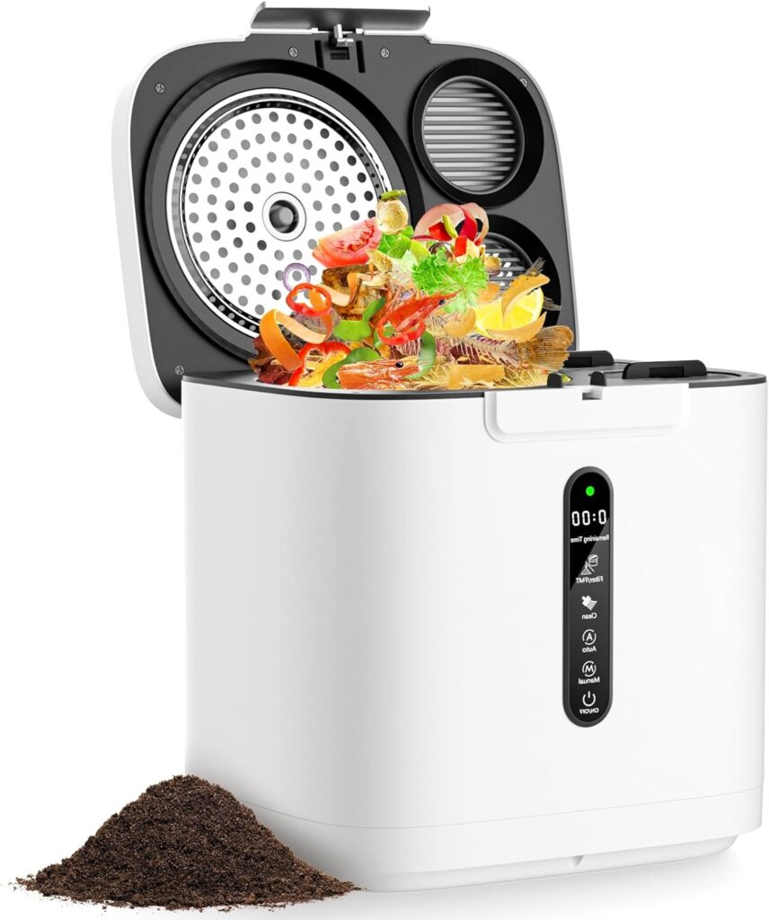 A white electric kitchen composter with a digital display and buttons. The lid is open, revealing food scraps inside. A pile of finished compost sits beside the machine.